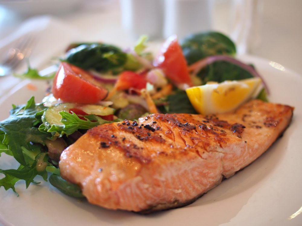 Salmon steak with salad