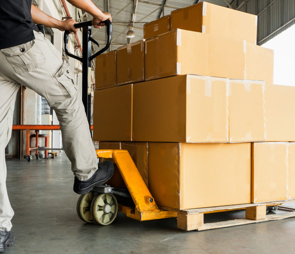 Worker,Courier,Unloading,Shipment,Goods,,Hand,Pallet,Truck,And,Stack